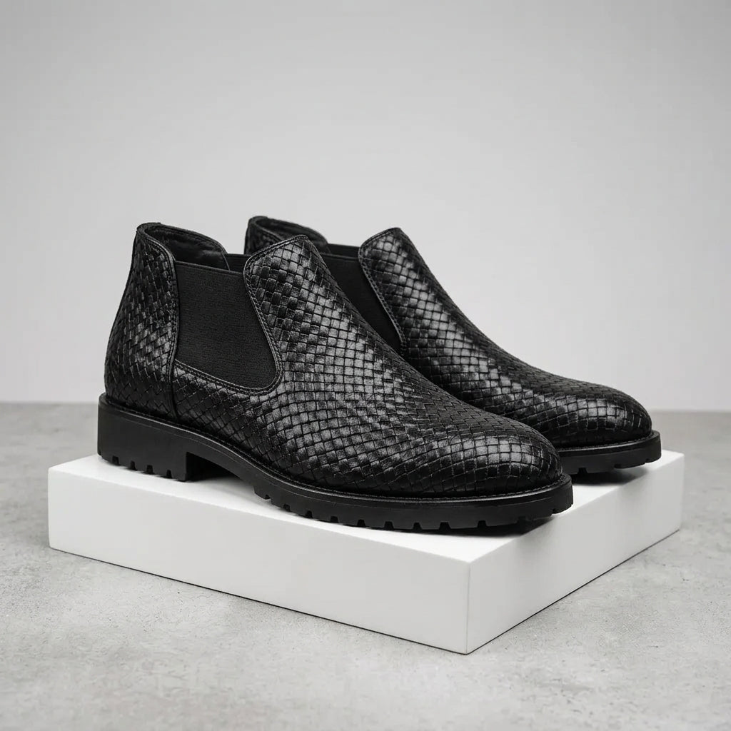 Black shoe with a strap on a white background